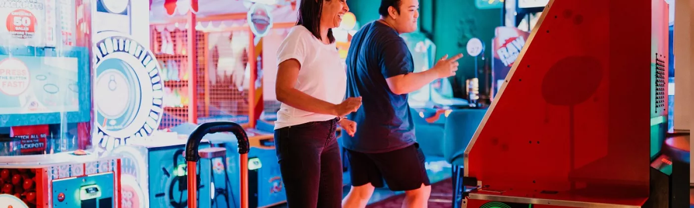 2 persons on a dance machine