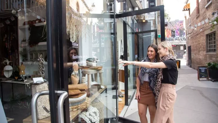 Shopping in Bakery Lane, two ladies looking at shopfront