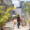 person standing and other sitting in California Lane